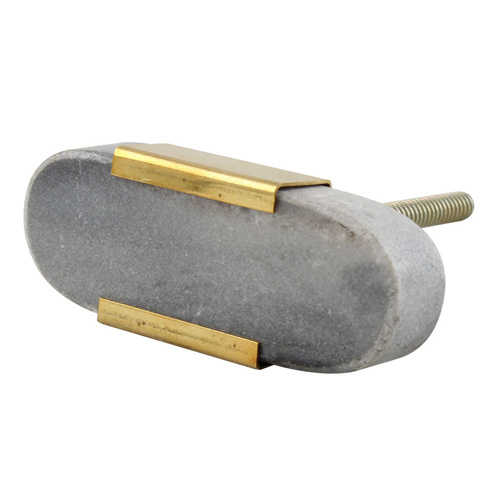 Grey oval stone and brass knob